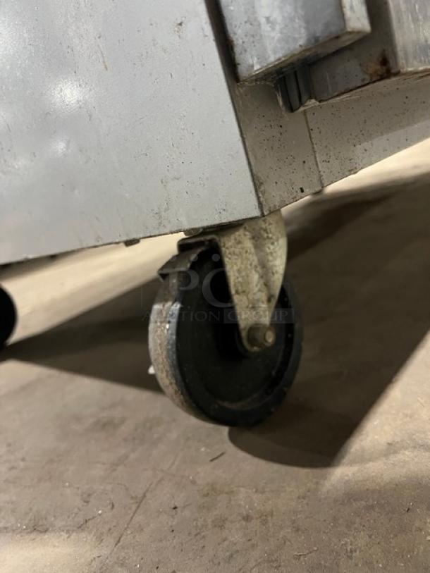 Beverage-Air Horizon Series top mount freezer caster wheel, Model HF2-1S, stainless steel, visible wear.