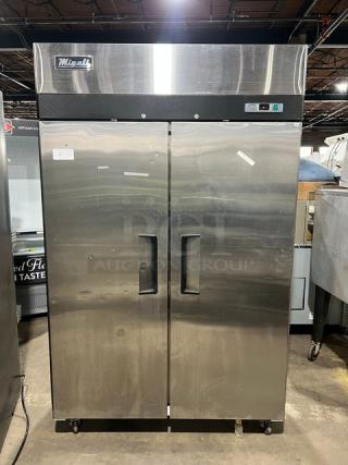 Migali T-Series C2F stainless steel 2-door vertical reach-in freezer, 2017 model, on casters, poly-coated wire rack included.