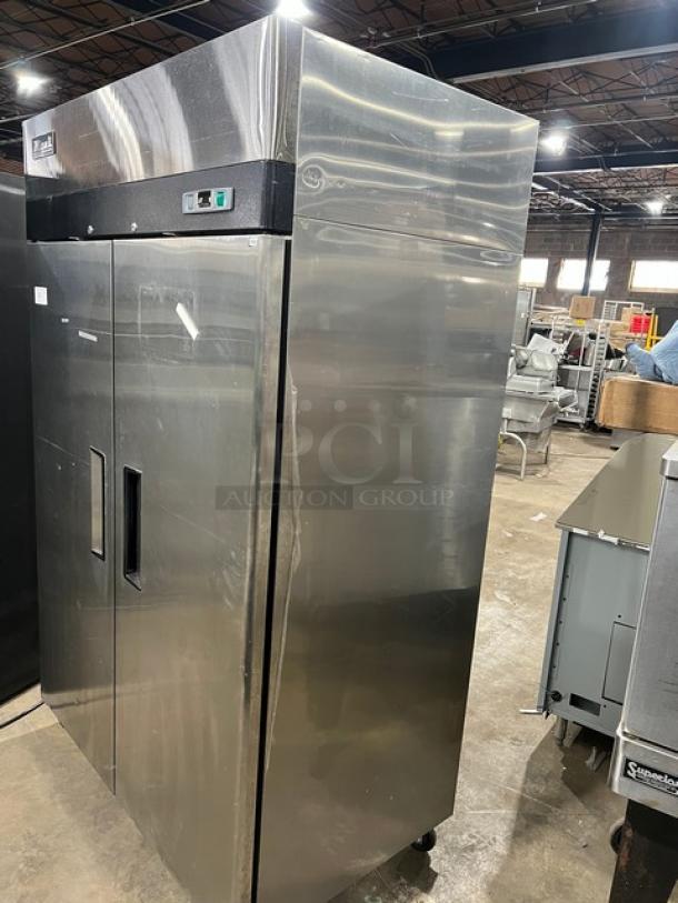 Migali T-Series C-2F 2-Door Stainless Steel Reach-In Freezer, 2017 model, with poly coated wire rack, on casters.