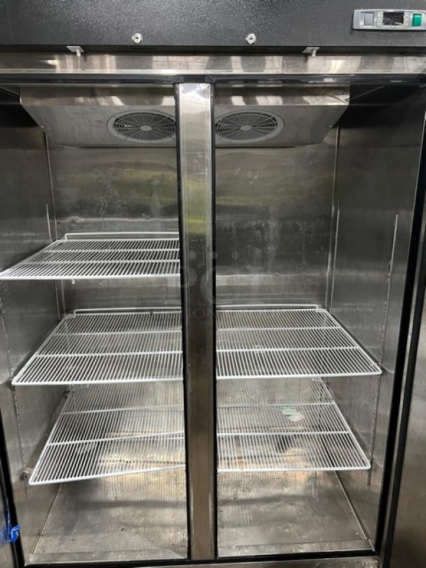 Migali 2017 T-Series 2 Door Commercial Freezer, Model C2F, stainless steel, poly-coated racks, on casters, 115V 1 Phase.