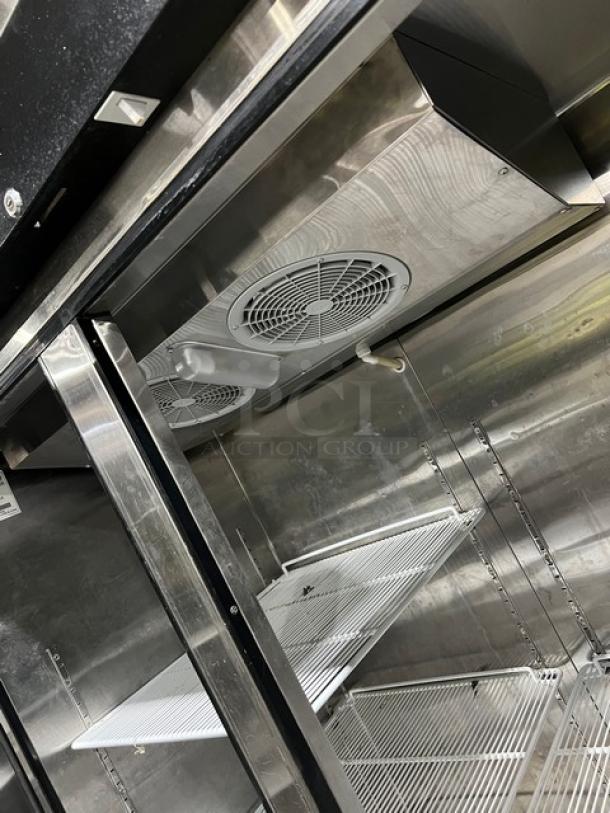 Migali T-Series commercial stainless steel 2-door freezer interior, model C2F, with poly-coated wire racks, on casters.