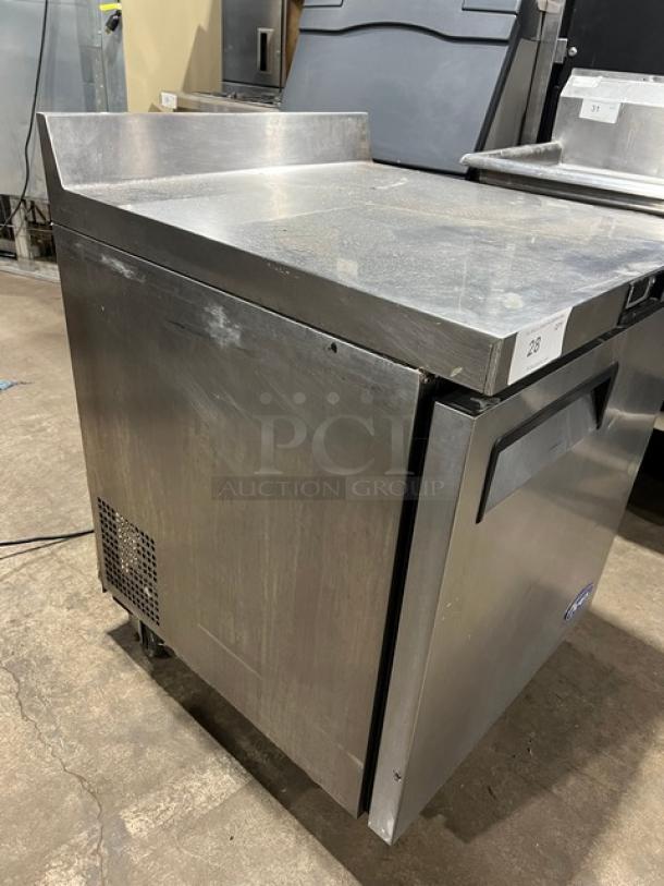 Atosa 2023 commercial stainless steel single door worktop refrigerator, model MGF8408GR, with up-turned backsplash, poly-coated wired rack, and casters.