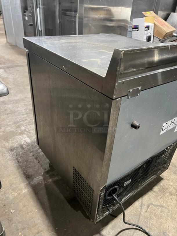 Atosa MGF8408GR stainless steel single door worktop refrigerator with upturned backsplash, poly coated rack, on casters.