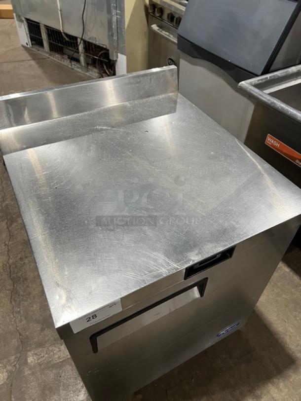 Atosa 2023 stainless steel single door worktop refrigerator, model MGF8408GR, with up-turned backsplash and casters.