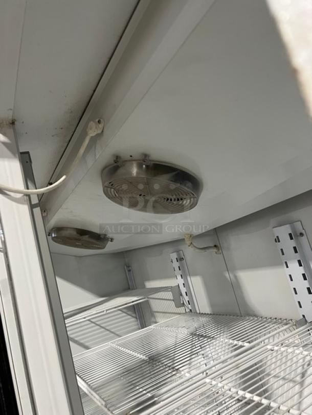 Master-Bilt BLG-74HD merchandiser refrigerator interior, showing poly-coated wire racks and fans. Energy Star certified.