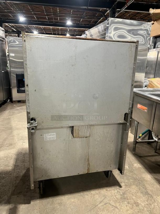 Royal Commercial Stainless Steel Range/Oven Combo, Model RR-6, natural gas, on casters, with backsplash & shelf.