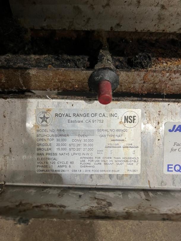 Royal commercial stainless steel range/oven, model RR6, natural gas, 6 burners, backsplash, salamander shelf, wired rack, on casters, NSF certified.