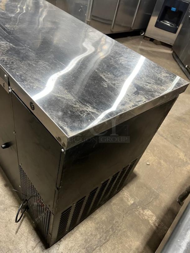 Continental Commercial Black 3-Door Back Bar Refrigerator, Model BB79N, with stainless steel worktop, poly-coated rack, 115V.