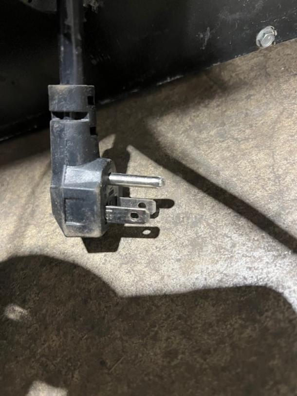 Continental Commercial 3 Door Black Back Bar Refrigerator, Model BB79N, with stainless steel worktop and poly-coated rack.