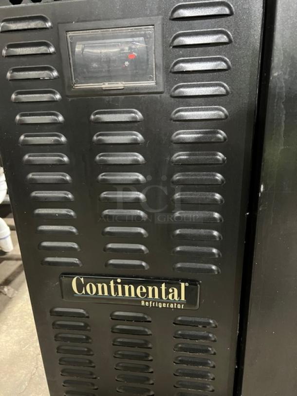 Continental BB79N black 3-door back bar refrigerator with stainless steel worktop, visible brand label, and vented design.