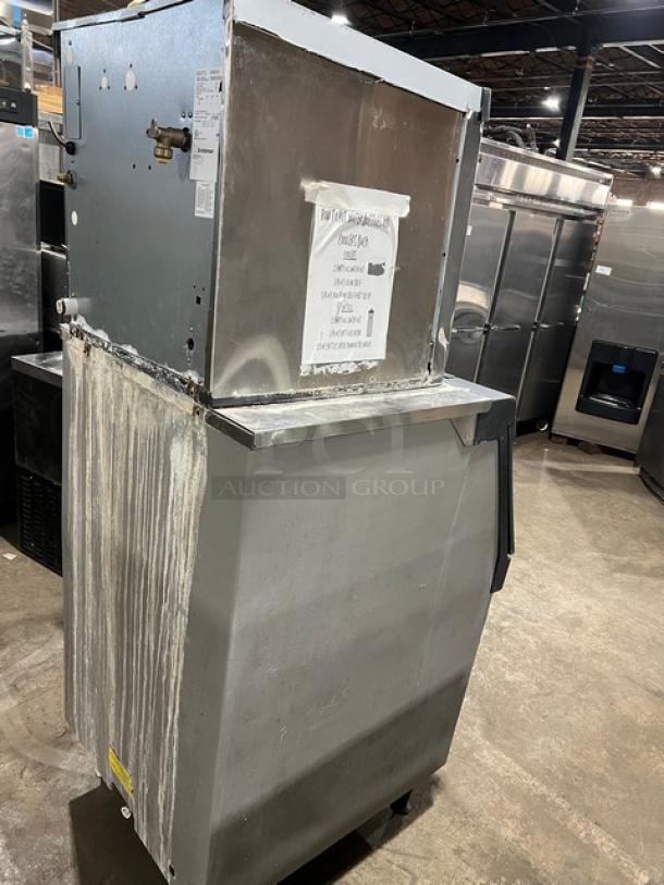 Scotsman Prodigy Series commercial ice maker, model N0422W1A/B530P. Stainless steel, water-cooled, electric, on legs, worn condition.