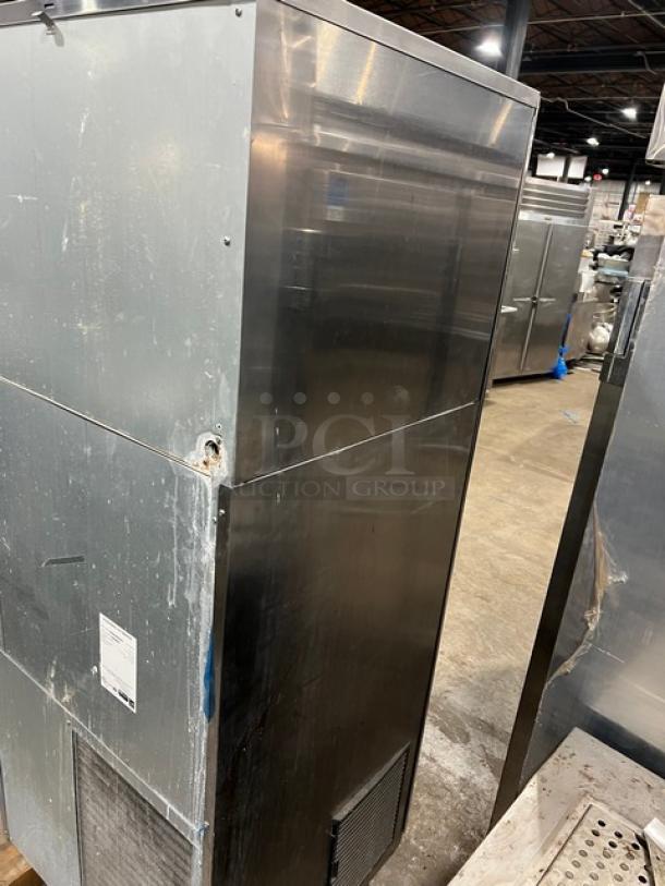 Hoshizaki DKM-500BAH ice machine, stainless steel, Energy Star certified, with built-in storage bin and drip tray. Visible wear.