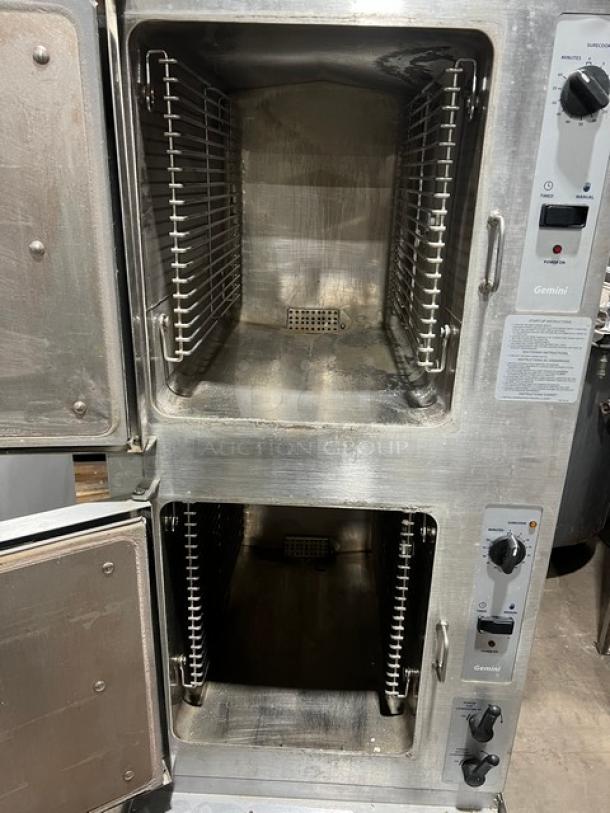 Cleveland Range Gemini Series dual compartment convection steamer, Model 24CGA10.2, stainless steel, natural gas, 10-pan capacity, 115V 1 Phase, on legs. Equipped with individual controls, SN: 180623053558.