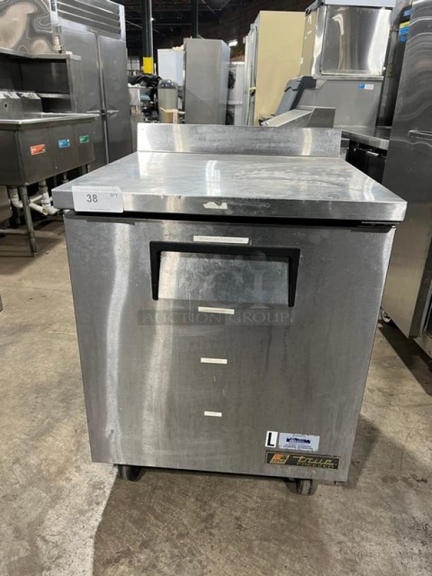 True TWT-27F stainless steel worktop freezer with up-turned backsplash, poly coated rack, on casters. Serial: 7644121.