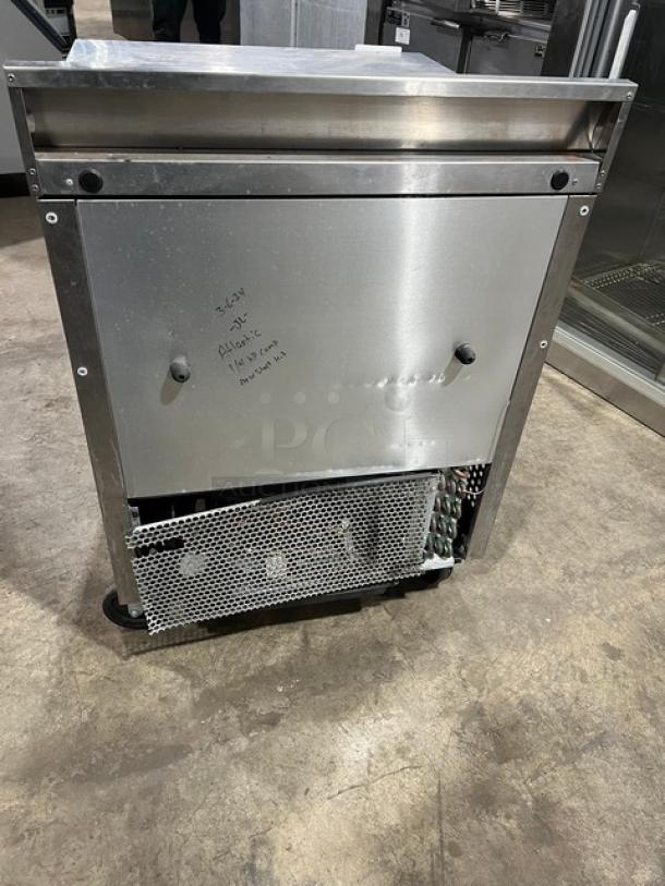 True TWT-27F commercial stainless steel worktop freezer, single door, upturned backsplash, poly coated rack, on casters.