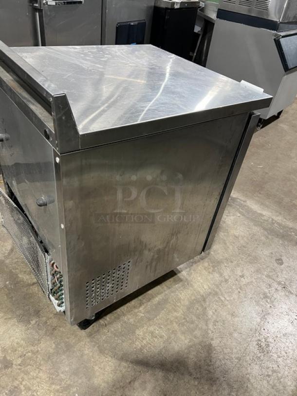 True TWT-27F stainless steel worktop freezer, single door, up-turned backsplash, poly-coated rack, on casters, model TWT27F.