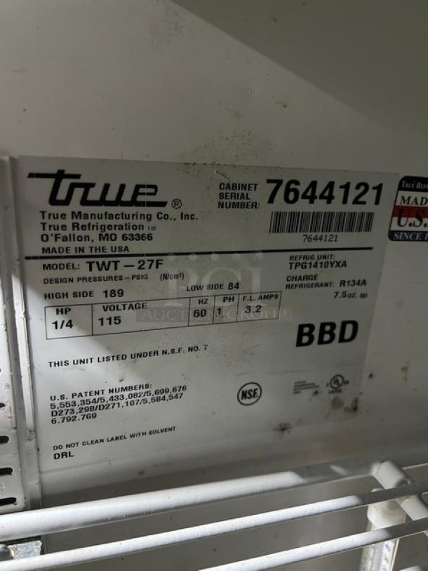 True commercial stainless steel single door worktop freezer, model TWT-27F, with up-turned backsplash, poly-coated wire rack, on casters, SN: 7644121, 115V, 1 Phase.
