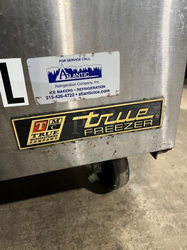 True TWT-27F commercial stainless steel worktop freezer with upturned backsplash, poly coated rack, and casters. 115V, 1 phase.