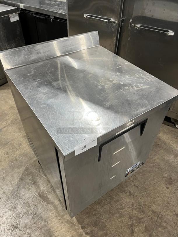 True TWT-27F stainless steel worktop freezer with up-turned backsplash, poly-coated wired rack, on casters. Model TWT27F, SN: 7644121.