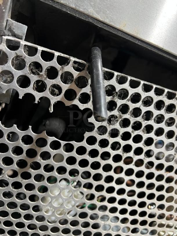 True TWT-27F commercial stainless steel worktop freezer, featuring a solid single door, up-turned backsplash, and poly-coated rack.