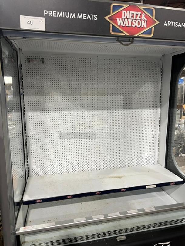 Ojeda ALPA120G2 refrigerated merchandiser display case with pull-down night curtain, Dietz & Watson branding, holds 120V, on legs.