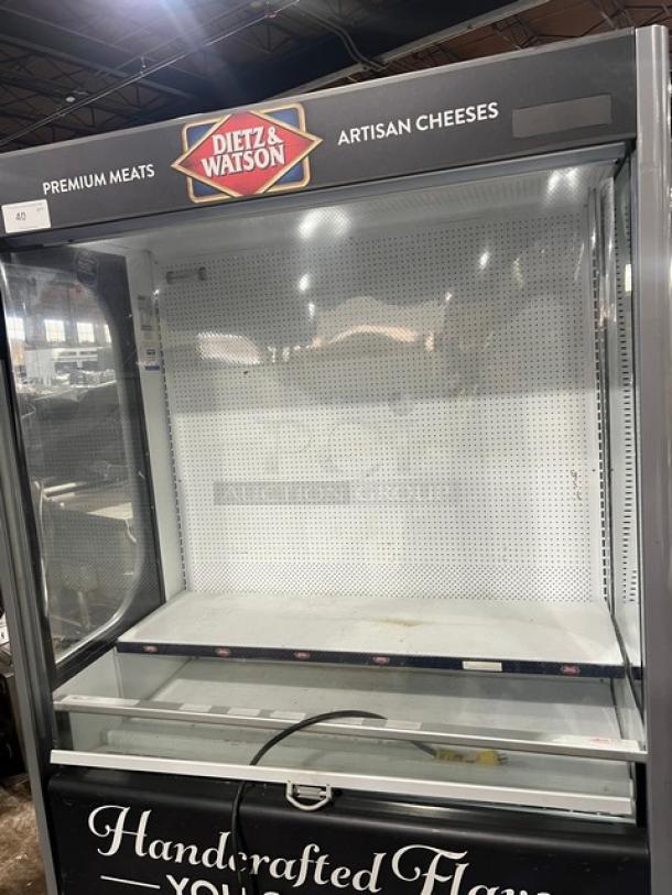 Ojeda ALPA120G2 refrigerated merchandiser display case, Dietz & Watson branding, pull-down night curtain, on legs, 120V.