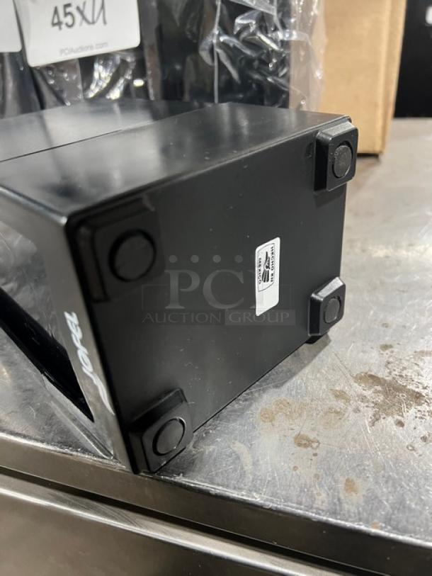 NEW Jofel black countertop tall-fold napkin dispenser, excellent condition, non-slip feet, visible brand label.