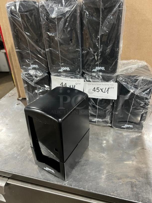 New Jofel black countertop/tabletop tall-fold napkin dispenser, commercial-grade, multiple units on display.