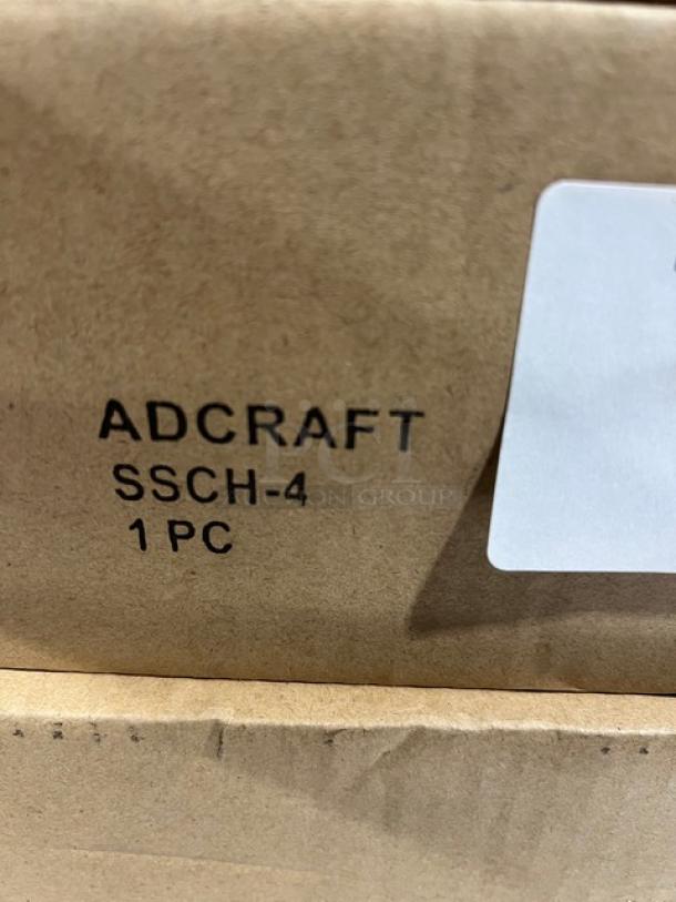 Adcraft SSCH-4 condiment holder box. Marked "Adcraft SSCH-4 1 PC." Contains stainless steel dispenser with acrylic lid.