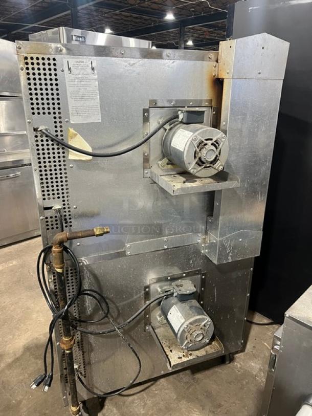 Southbend SL Series stainless steel gas-powered double-stacked convection oven. Wired oven rack, on casters. Robust condition.