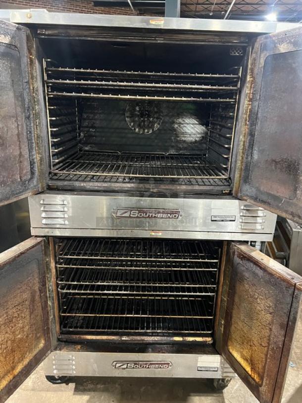 Southbend SL Series stainless steel gas-powered double stacked convection oven on casters, wired oven rack, worn condition.