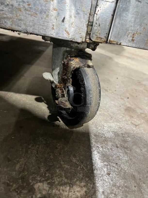 Southbend SL Series convection oven caster, showing signs of rust and wear on metal components, used condition.