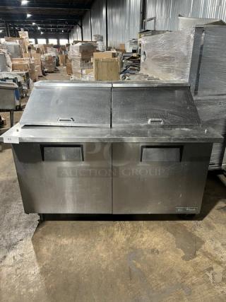 True TSSU-60-24M-B-ST-HC 2 Door Refrigerated Prep Table, stainless steel, wired racks, on casters, commercial use.