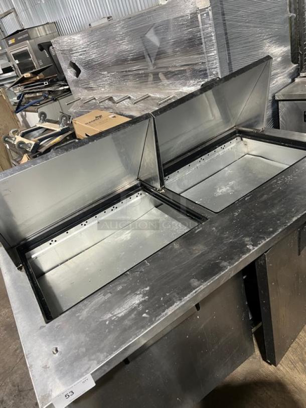 True commercial stainless steel 2-door refrigerated bain marie prep table, model TSSU-60-24M-B-ST-HC, on casters.