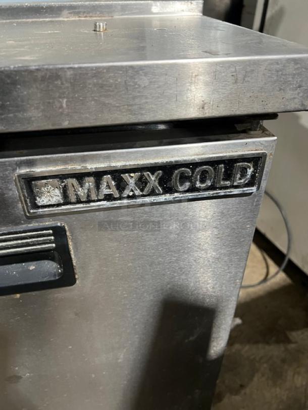 Maxx Cold MXCR60S stainless steel salad prep table with poly-coated rack and casters, labeled with brand name.