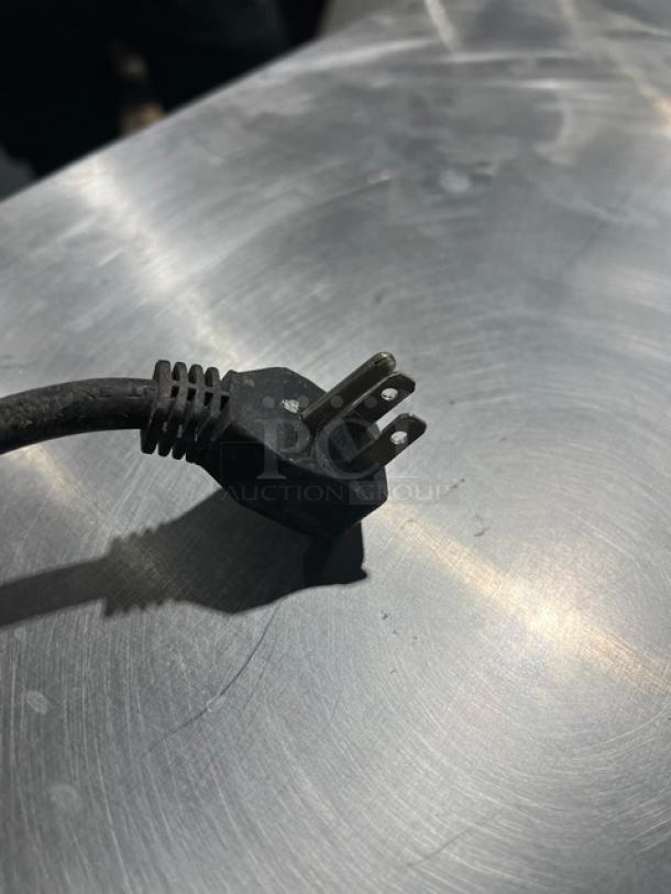 Maxx Cold MXCR60S refrigerated prep table power plug on stainless steel surface. 115V 1 Phase.