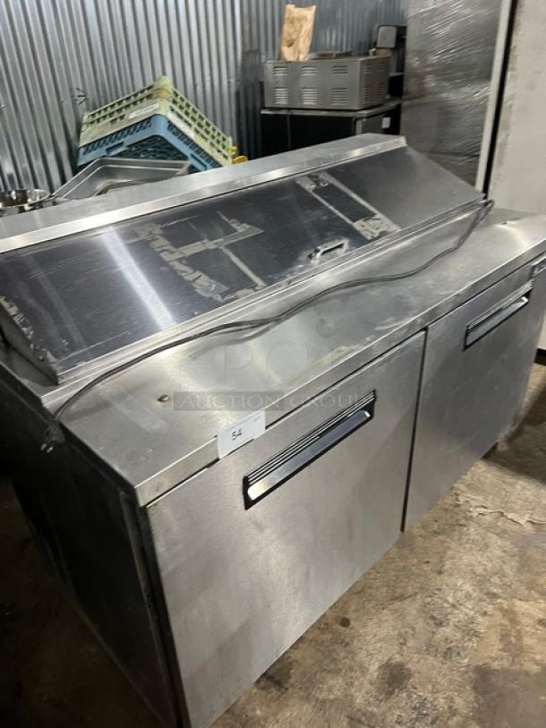 Maxx Cold MXCR60S stainless steel refrigerated prep table, bain marie style, with poly-coated wire rack, on casters.