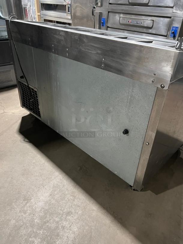 Continental CPA60 refrigerated pizza prep table, stainless steel, with wired rack, on casters, 115V, 1 phase, SN: 155C1556.