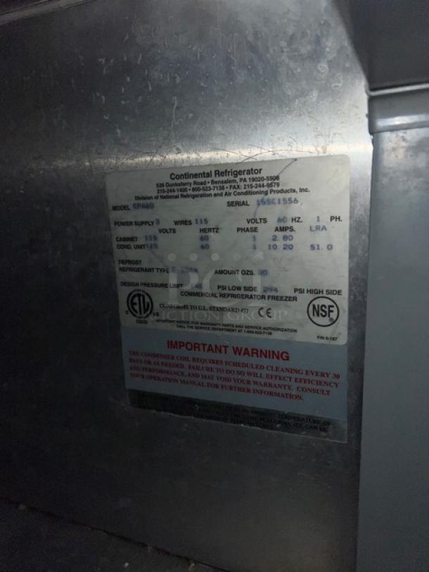 Continental CPA60 stainless steel pizza prep table with wired rack. Features 115V, 1 phase, on casters. Serial: 155C1556.