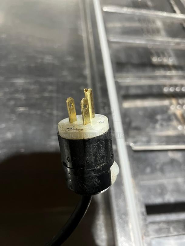 Continental CPA60 stainless steel refrigerated pizza prep table plug, 115V, 1 phase, on casters, with wired rack.