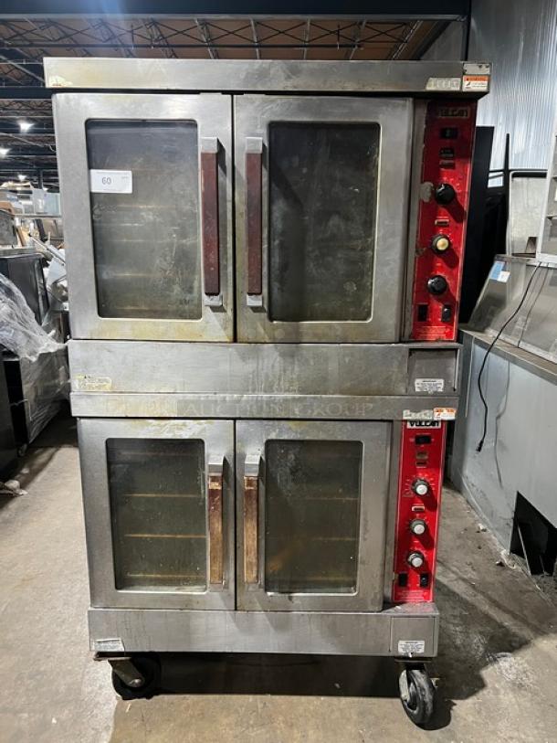 Vulcan commercial double-stacked convection oven, stainless steel, with wired rack, on casters. Features visible control knobs.
