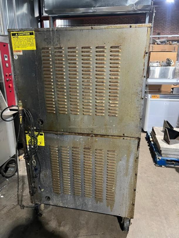 Vulcan commercial double-stacked convection oven on casters, stainless steel, electric powered, includes wired oven rack.