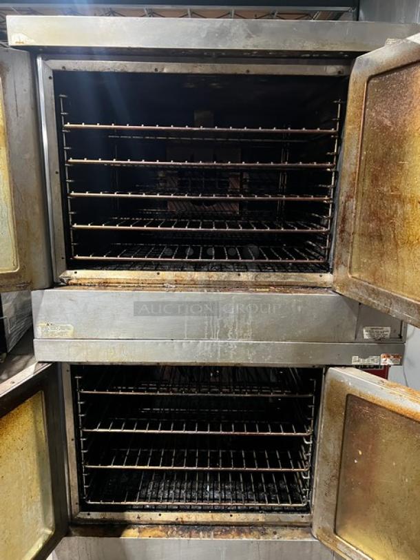 Vulcan double-stacked convection oven, stainless steel, electric, on casters, with wired oven rack. Visible wear on doors.