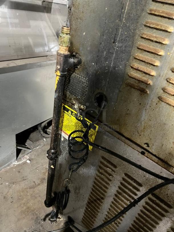 Vulcan Commercial Stainless Steel Double-Stacked Electric Convection Oven, wired rack, on casters, visible wear, warning label.