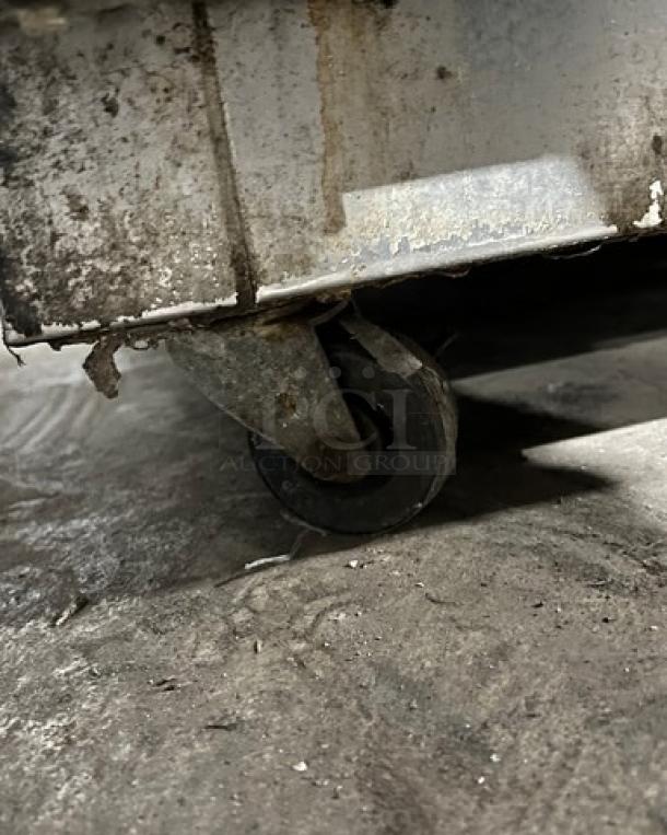 Maxx Cold MXCR60S refrigerated prep table on casters; features stainless steel construction and poly-coated wire rack.