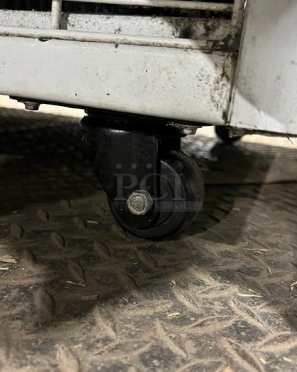 Master-Bilt FLR60 ice cream topping unit caster; white exterior, shows dirt and wear, 115V, 1 Phase, model SN: 31169-C-011.