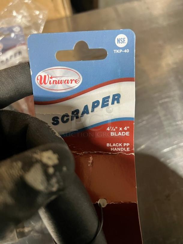 Winco TKP-40 scraper with 4¾" x 4" stainless steel blade, black slip-resistant polypropylene handle, new condition.
