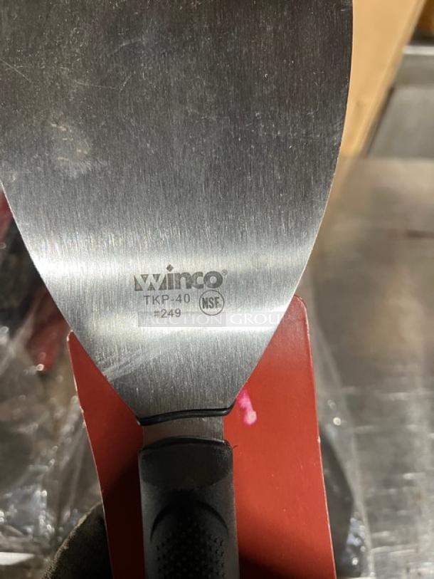 Winco TKP40 steel handheld scraper, new condition, with slip-resistant black polypropylene grip and NSF marking.