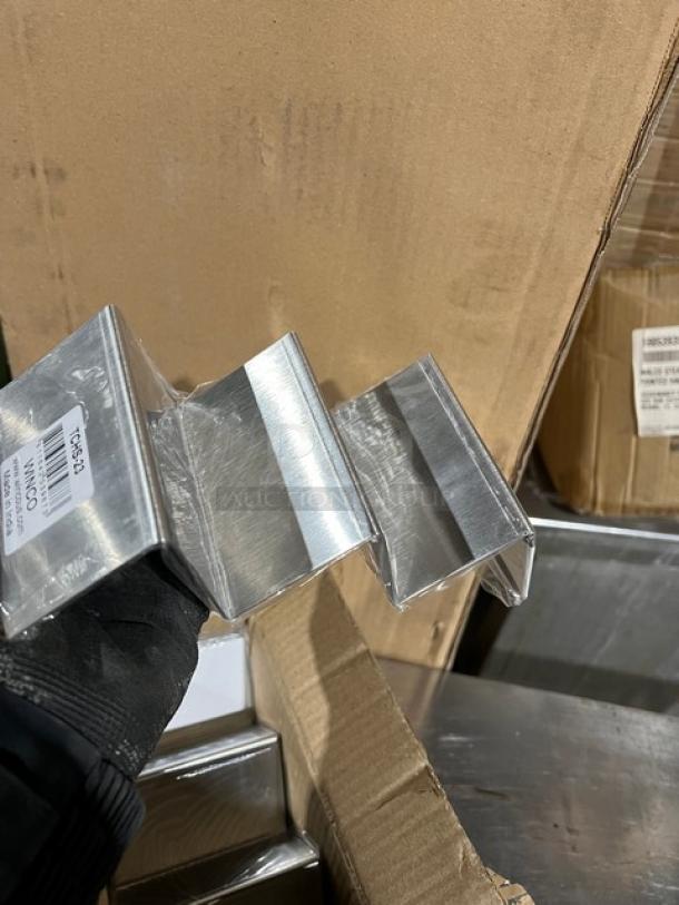 New Winco stainless steel 2-3 slot taco holder, model TCHS23, in pristine condition with packaging visible.