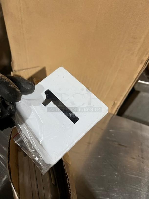 Winco TBN25 tabletop placard set, new condition, numbers 1-25, white color, ideal for commercial use.